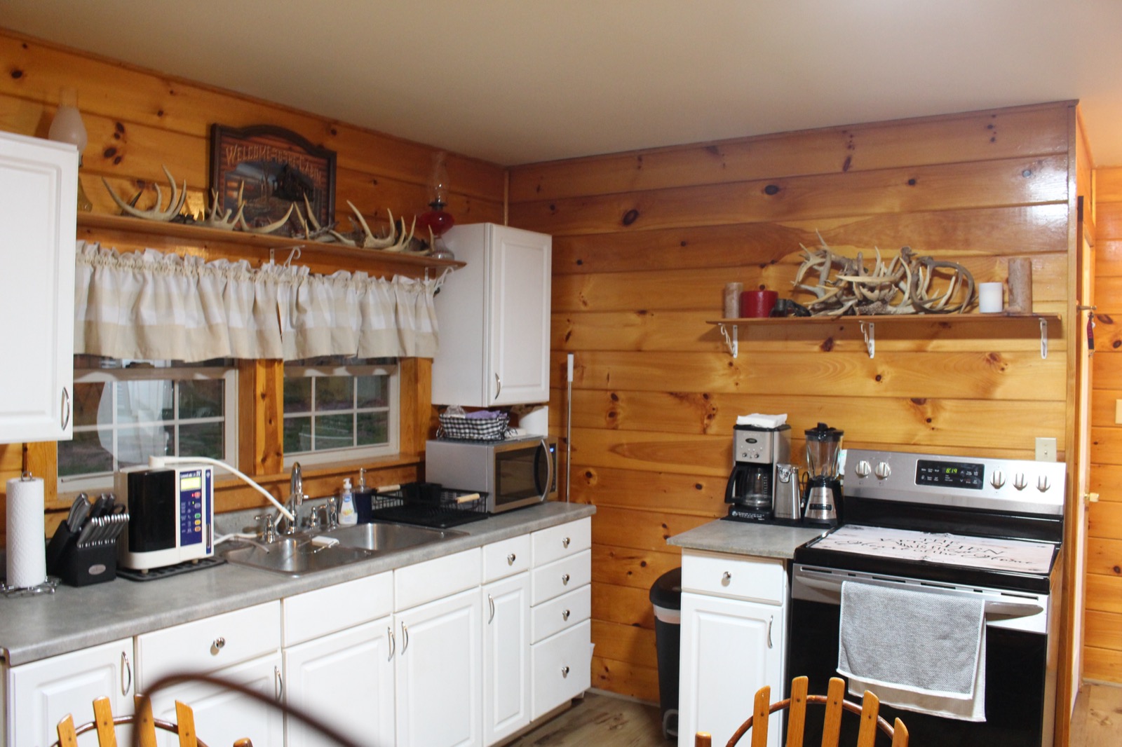 Full kitchen with antler shelf decor